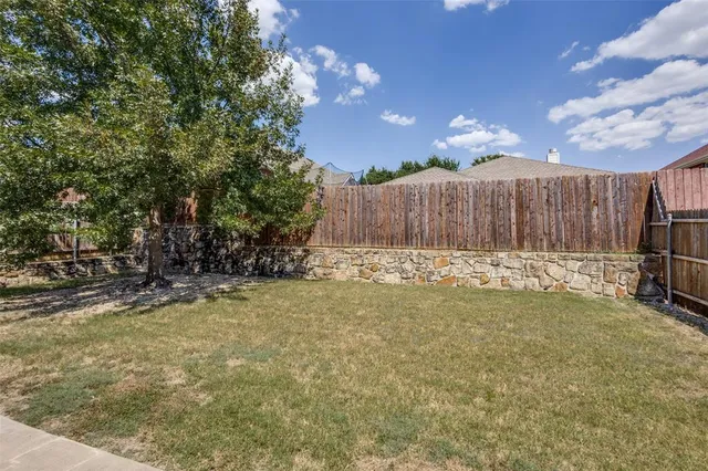 a view of a backyard of the house