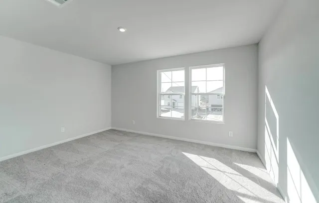 an empty room with windows