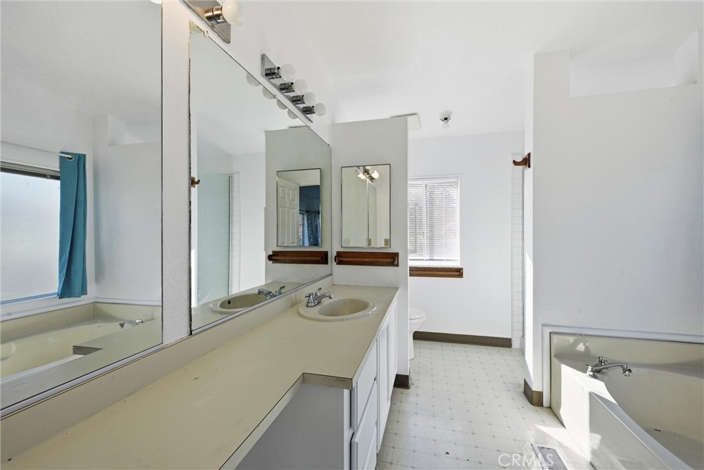 6763 Collier Avenue, Unit 10 Upper Lake, CA 95485 - Photo 20 of 35 a bathroom with a tub sink and mirror