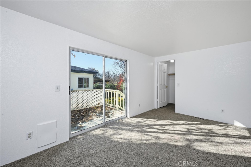6763 Collier Avenue, Unit 10 Upper Lake, CA 95485 - Photo 23 of 35 a view of a livingroom with wooden floor and a sliding door