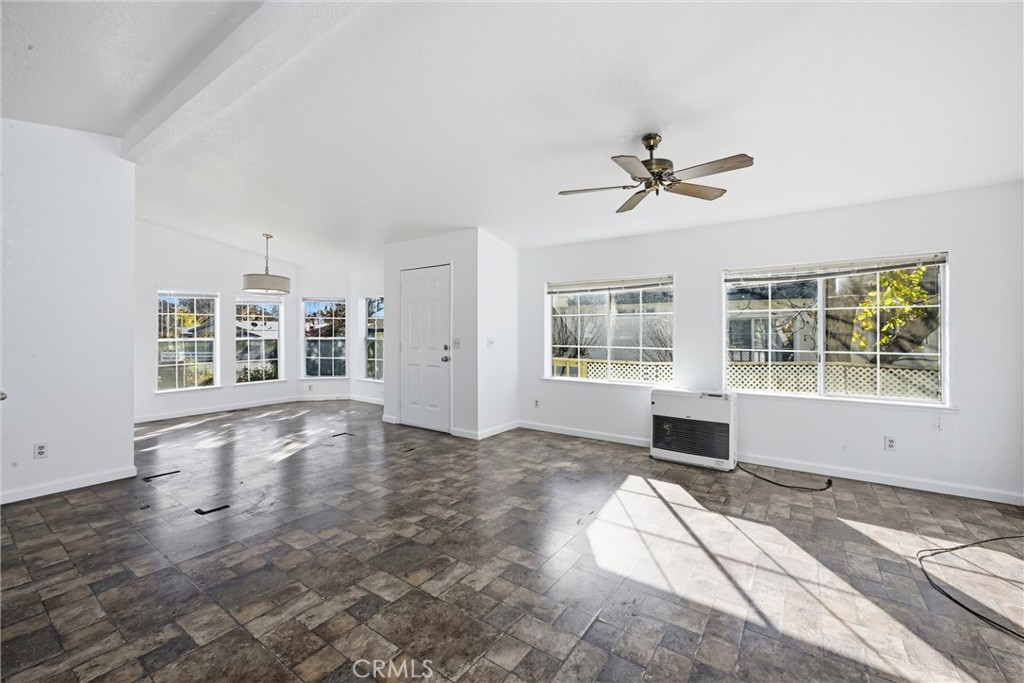 6763 Collier Avenue, Unit 10 Upper Lake, CA 95485 - Photo 9 of 35 a view of an empty room with a window and wooden floor
