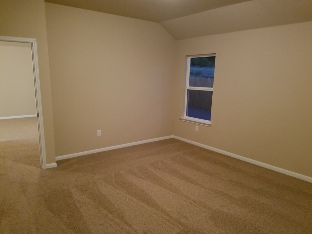 5905 Montrelia Drive Austin, TX 78724 - Photo 11 of 25 a view of an empty room with a window