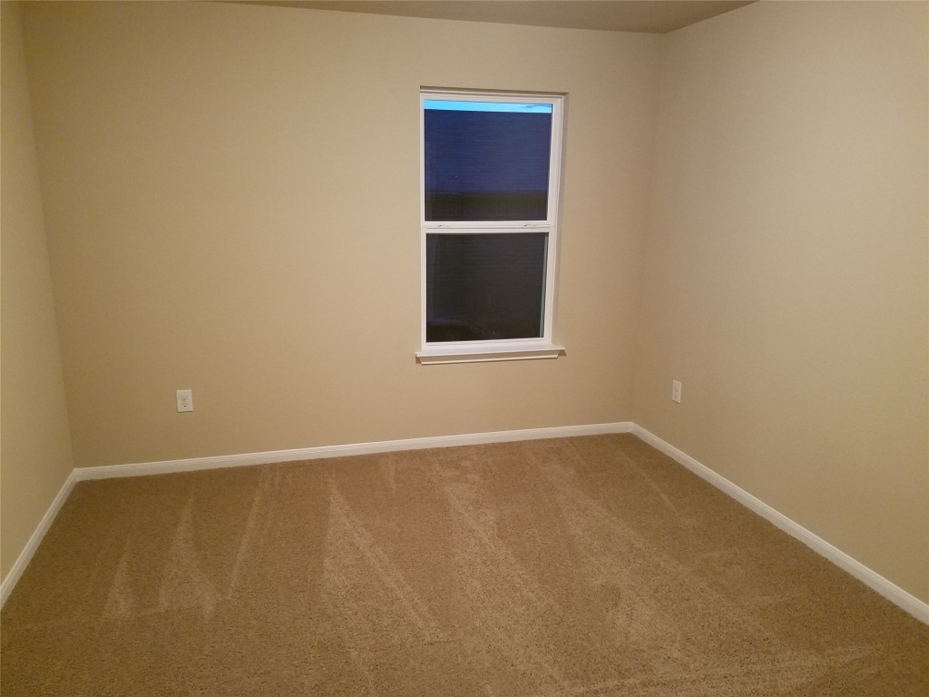 5905 Montrelia Drive Austin, TX 78724 - Photo 18 of 25 an empty room with a window