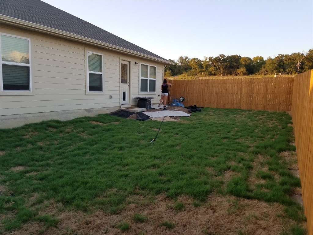 5905 Montrelia Drive Austin, TX 78724 - Photo 25 of 25 a view of a house with backyard and garden