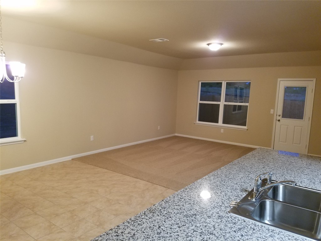5905 Montrelia Drive Austin, TX 78724 - Photo 5 of 25 an empty room with a sink