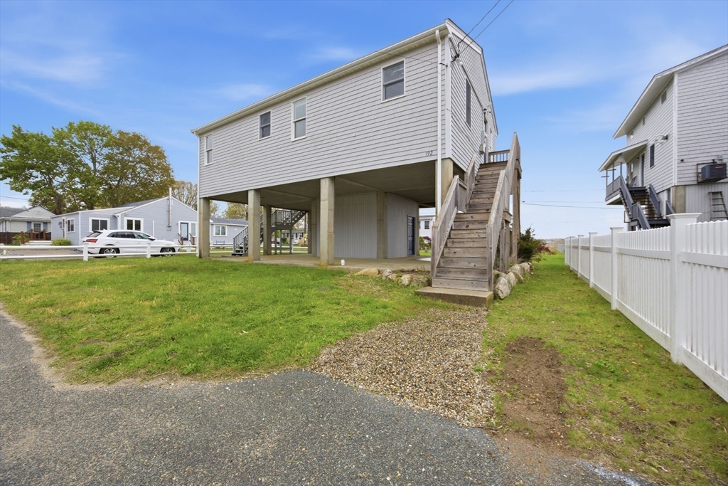 192 Swifts Beach Road Wareham, MA 02571 - Photo 5 of 38 a view of a house with a yard and porch