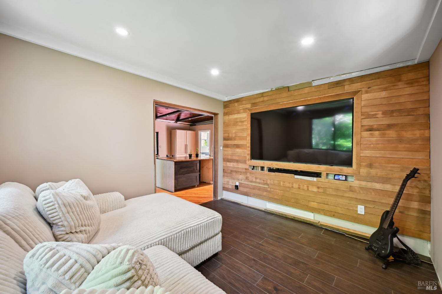 21713 Starrett Hill Drive Monte Rio, CA 95462 - Photo 20 of 50 a living room with furniture and a flat screen tv