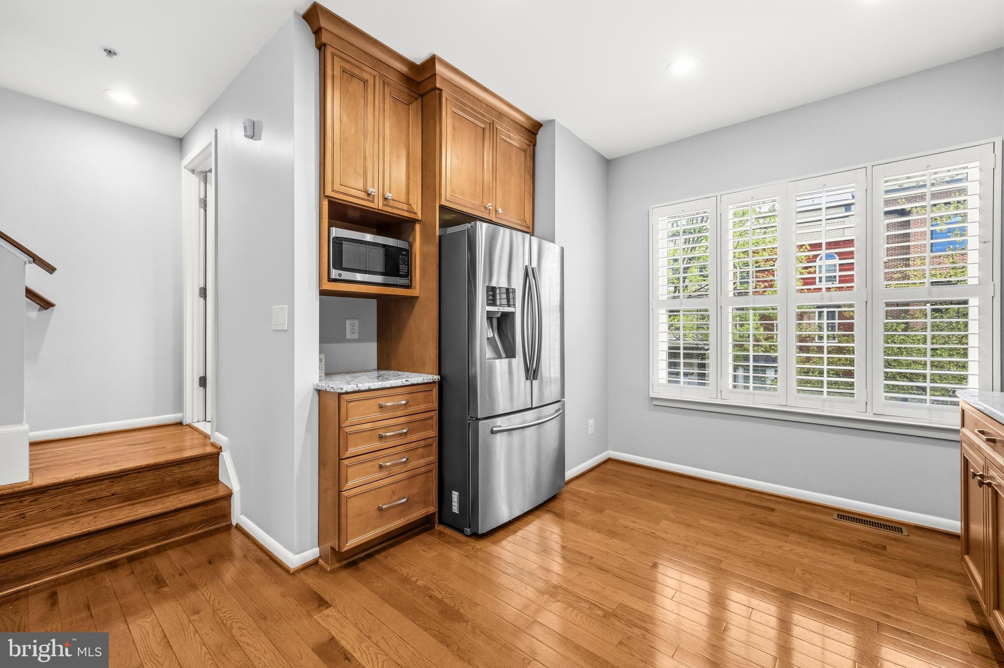 2116 12th Street Northwest Washington, DC 20009 - Photo 12 of 35 a view of an empty room with a kitchen and a window