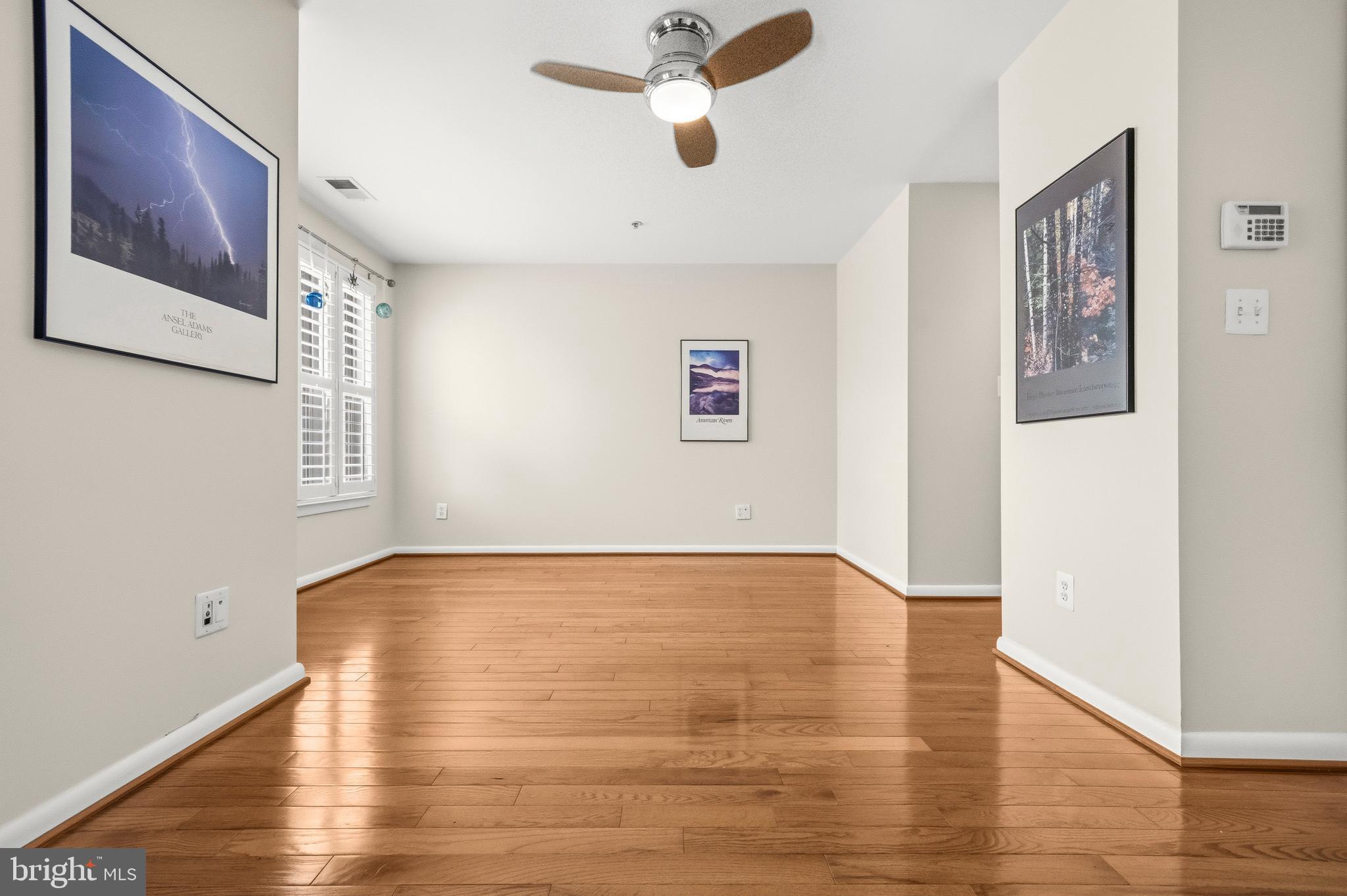 2116 12th Street Northwest Washington, DC 20009 - Photo 16 of 35 a view of an empty room with wooden floor