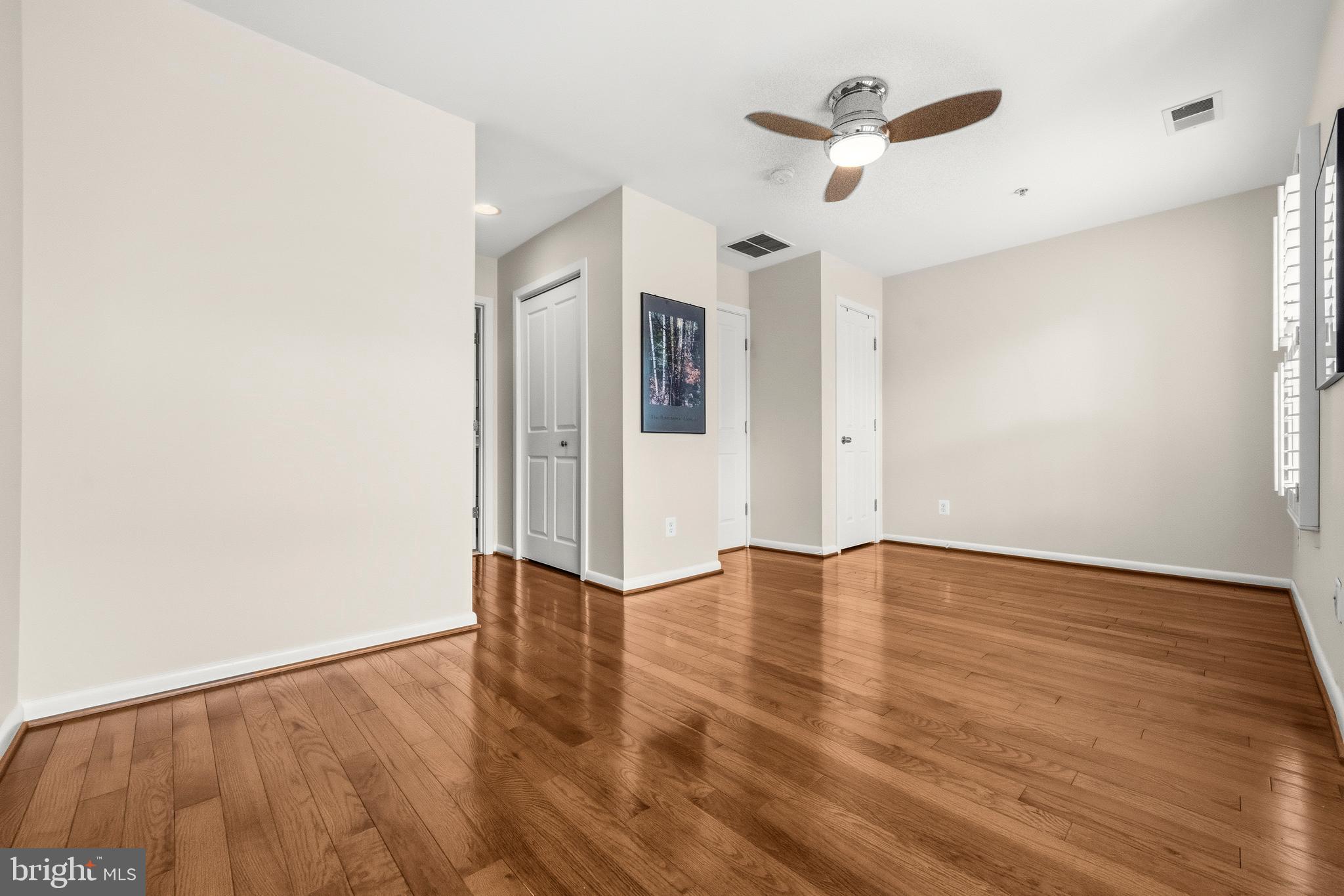 2116 12th Street Northwest Washington, DC 20009 - Photo 17 of 35 a view of an empty room with wooden floor