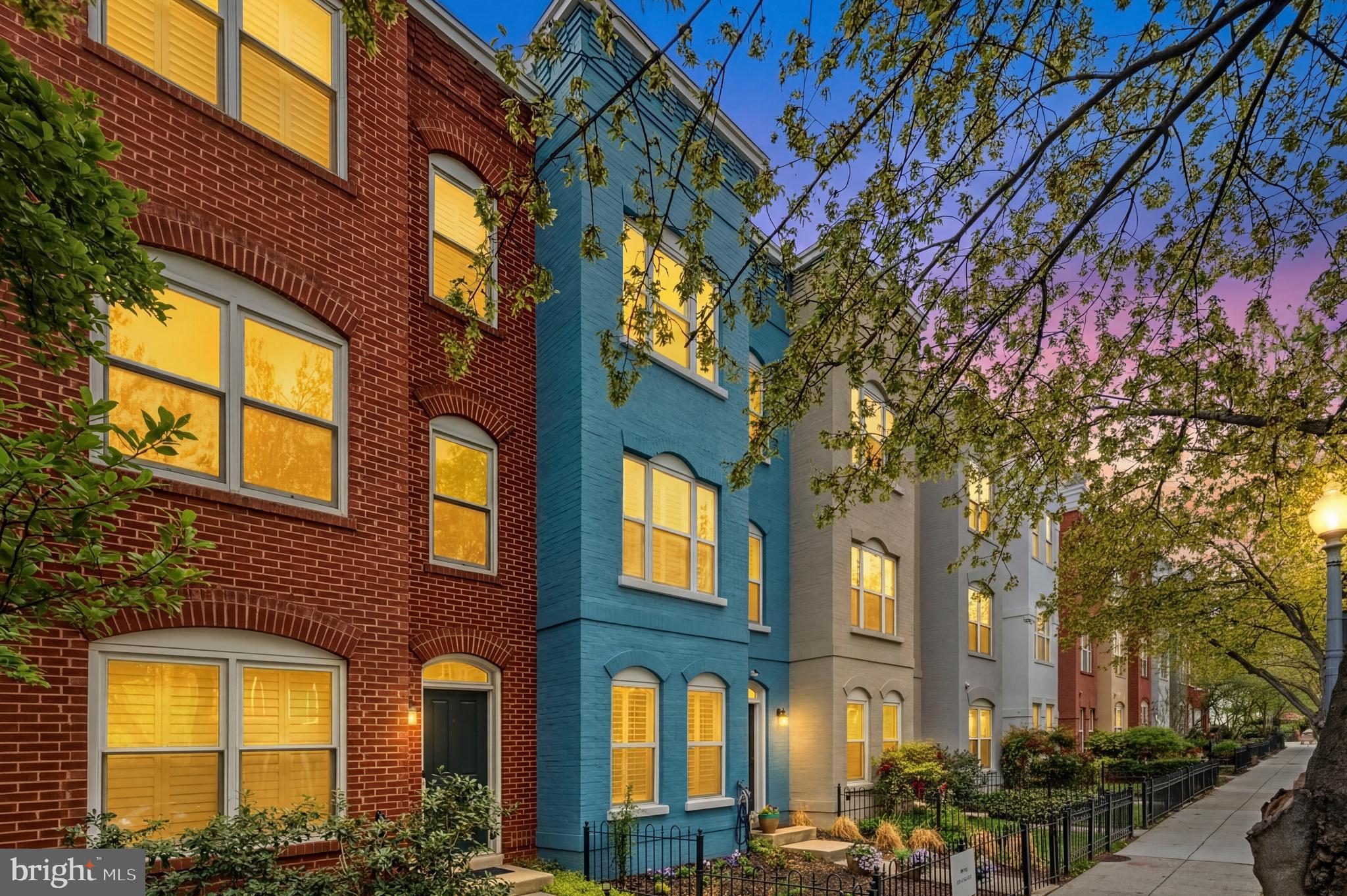 2116 12th Street Northwest Washington, DC 20009 - Photo 30 of 35 a yellow building with trees in front of it