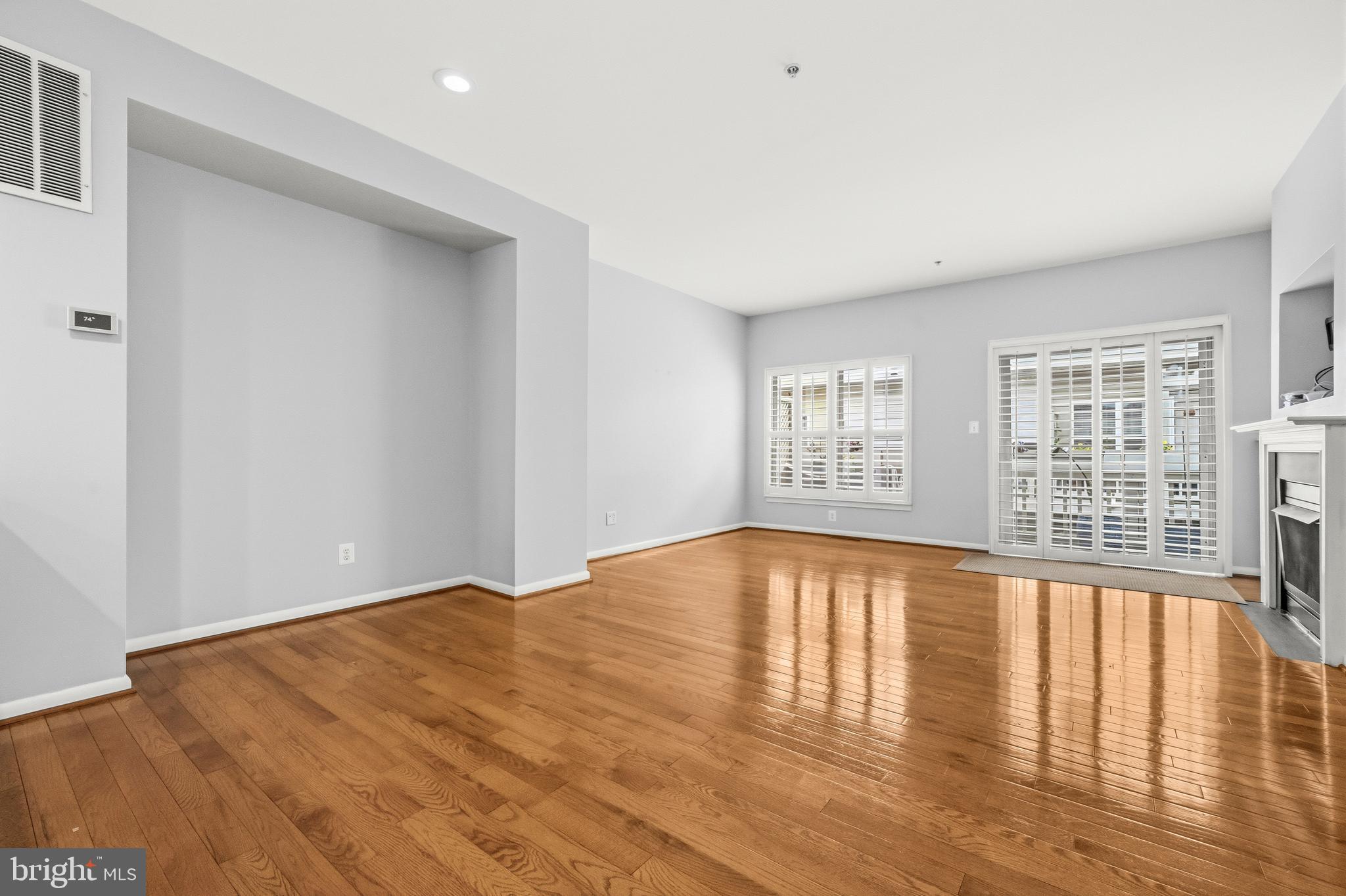 2116 12th Street Northwest Washington, DC 20009 - Photo 7 of 35 wooden floor in an empty room with a window