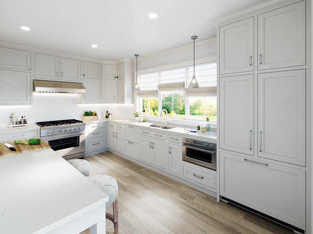 a kitchen with a sink a stove and white cabinets