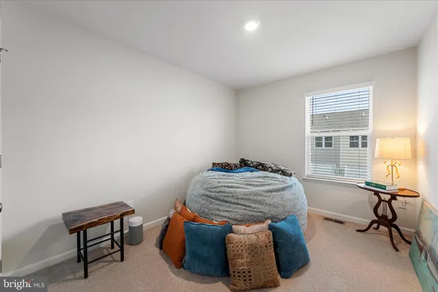 a room with chairs and a window