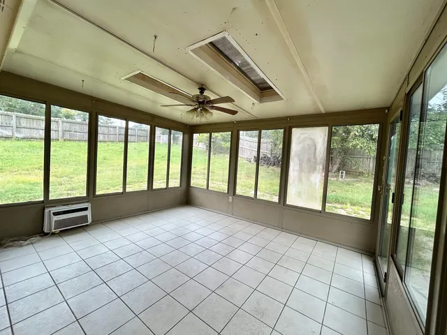 a view of an empty room with a large window