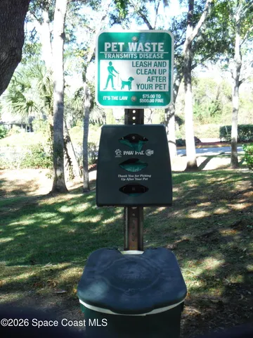 a sign that is in front of flowers