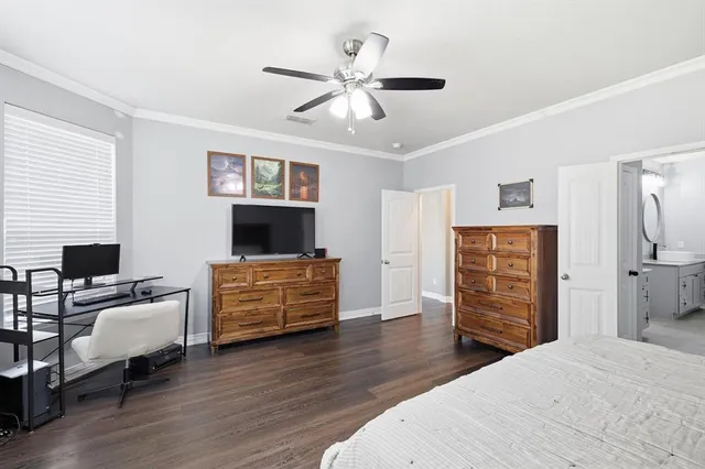 a bedroom with furniture and a bed