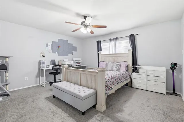 a bedroom with furniture and windows