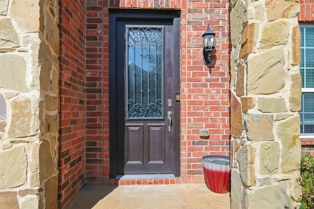 a brick building with a door and a window