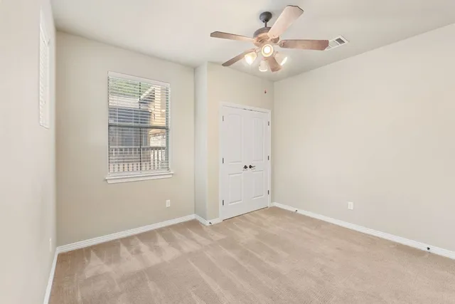 a kitchen with granite countertop a refrigerator stove and microwave