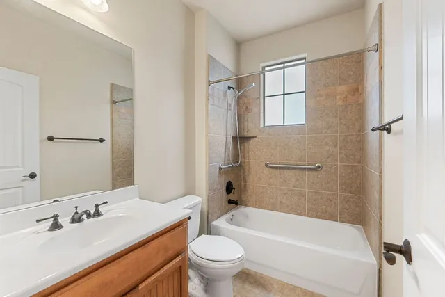 a bathroom with a sink a toilet and a bathtub