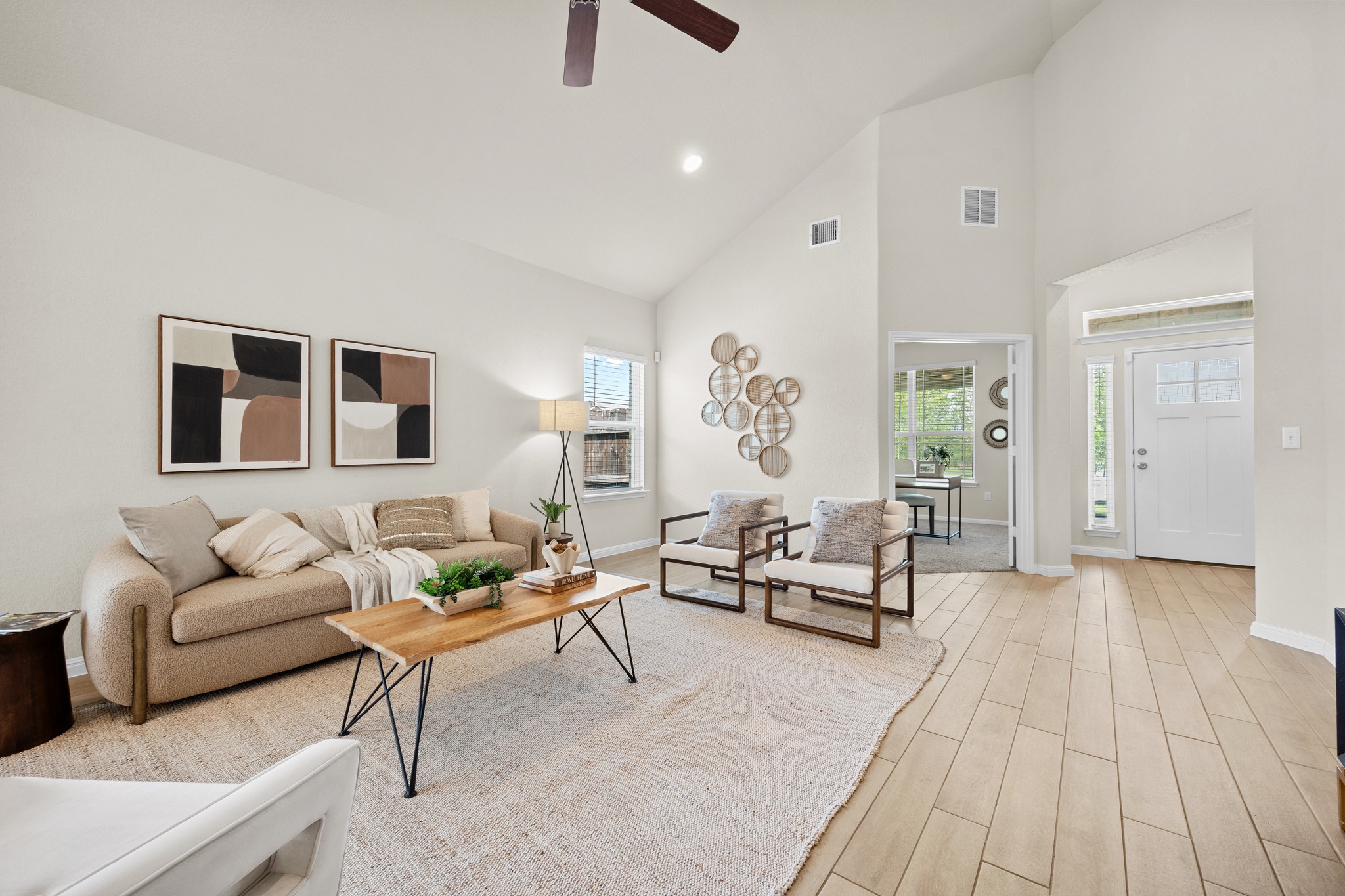 2413 Starhill Ranch Street Georgetown, TX 78628 - Photo 8 of 40 a living room with furniture and a large window