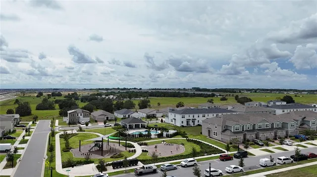 an aerial view of a house with a ocean view