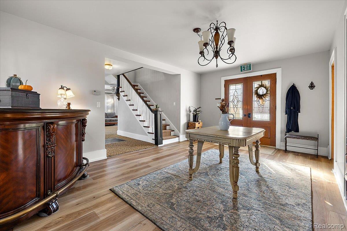 5815 Chicago Road Warren, MI 48092 - Photo 13 of 47 Office featuring a chandelier, light wood-type flooring, and french doors
