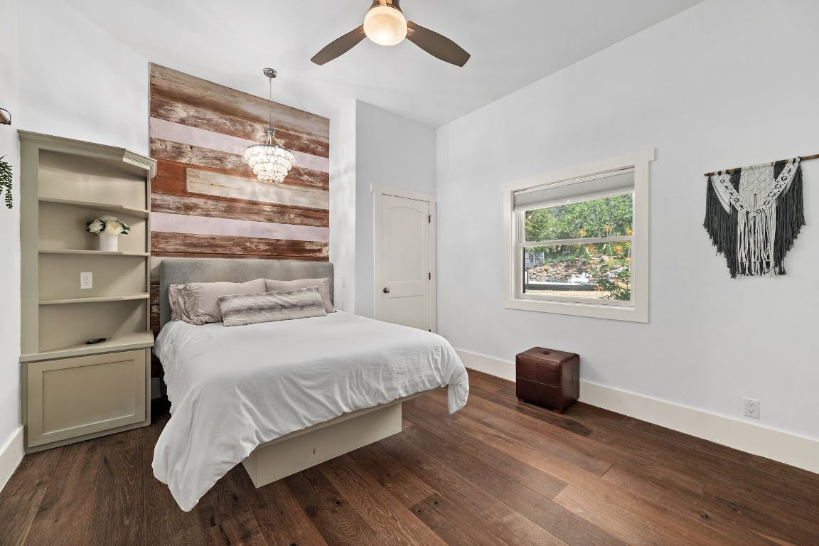 2001 Mestena Trail Austin, TX 78733 - Photo 20 of 40 a bedroom with a bed and a window