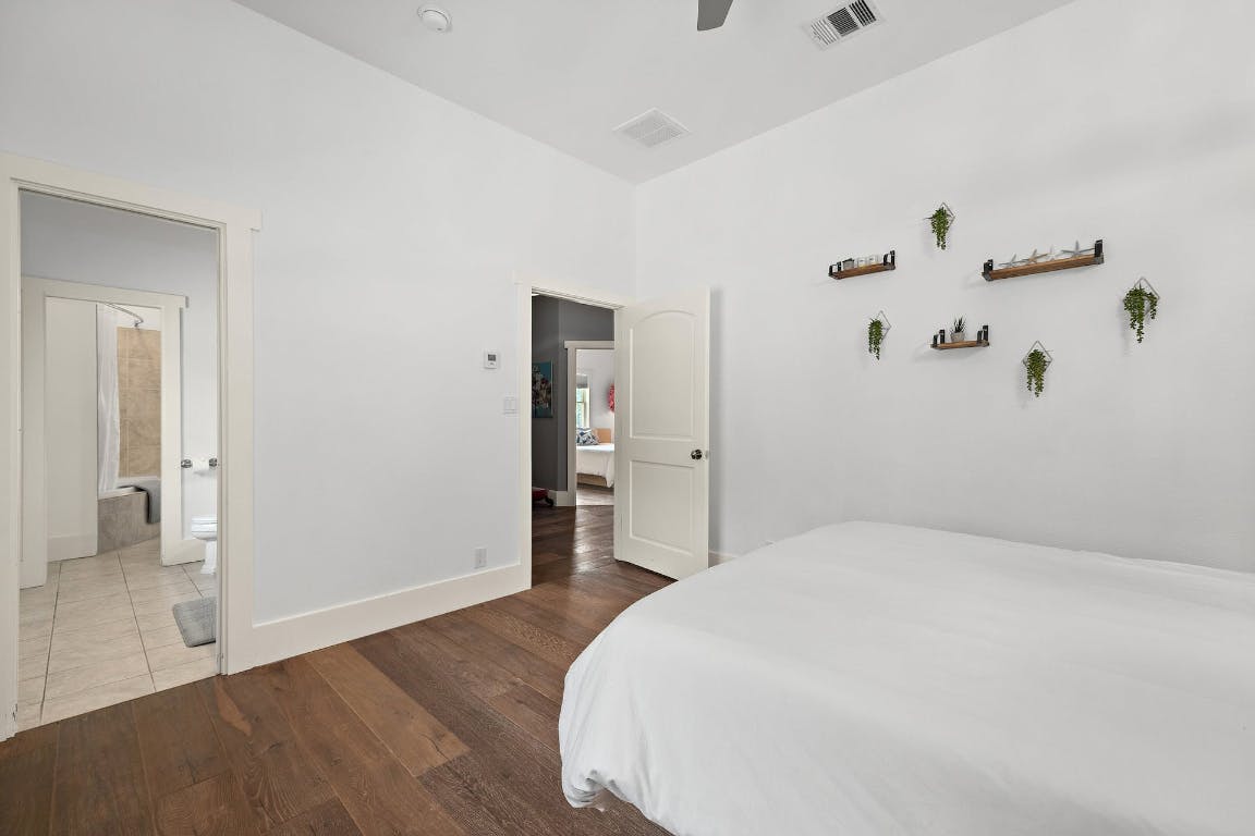 2001 Mestena Trail Austin, TX 78733 - Photo 21 of 40 a bedroom with a bed and closet