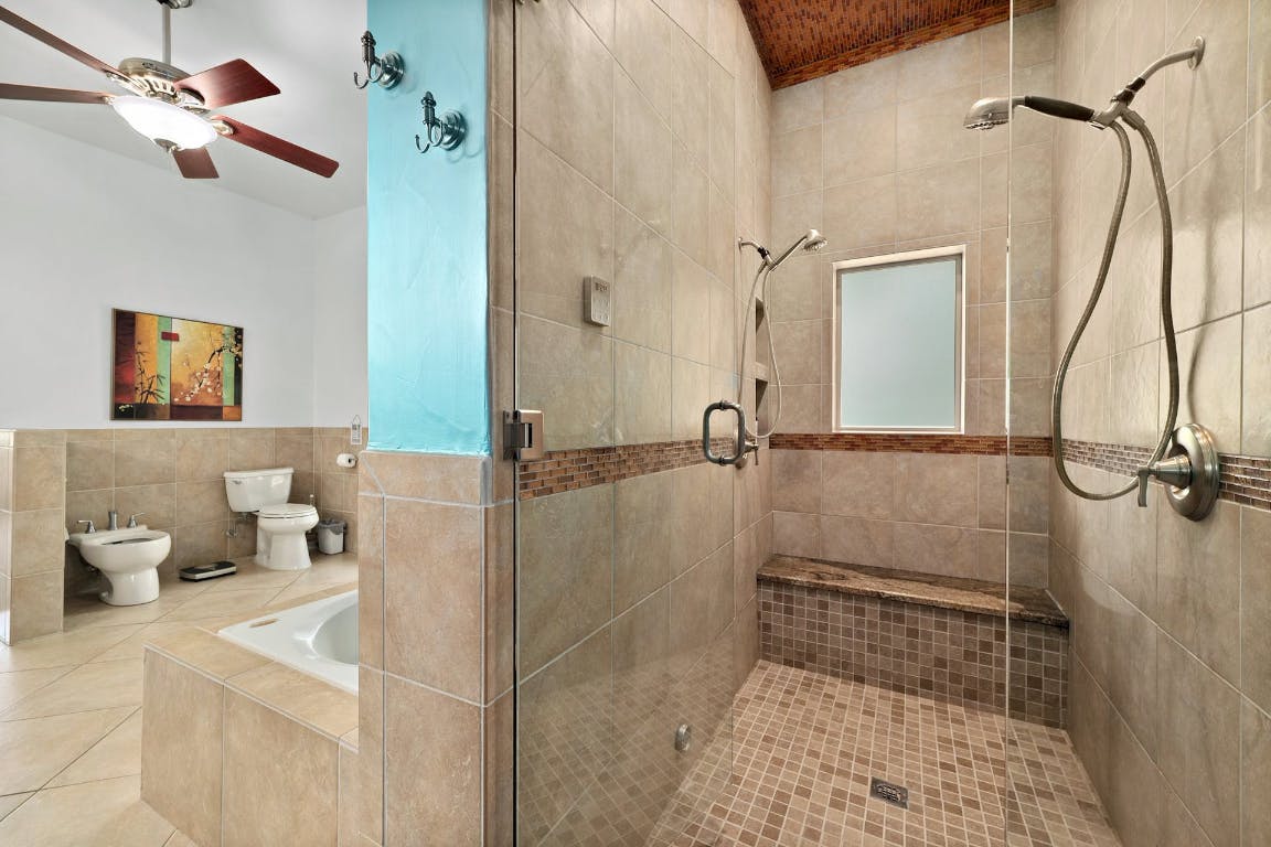 2001 Mestena Trail Austin, TX 78733 - Photo 36 of 40 a bathroom with a shower