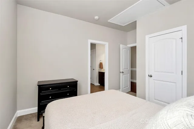 a bedroom with a bed and a cabinets