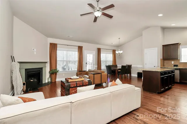 a living room with furniture fireplace and a flat screen tv