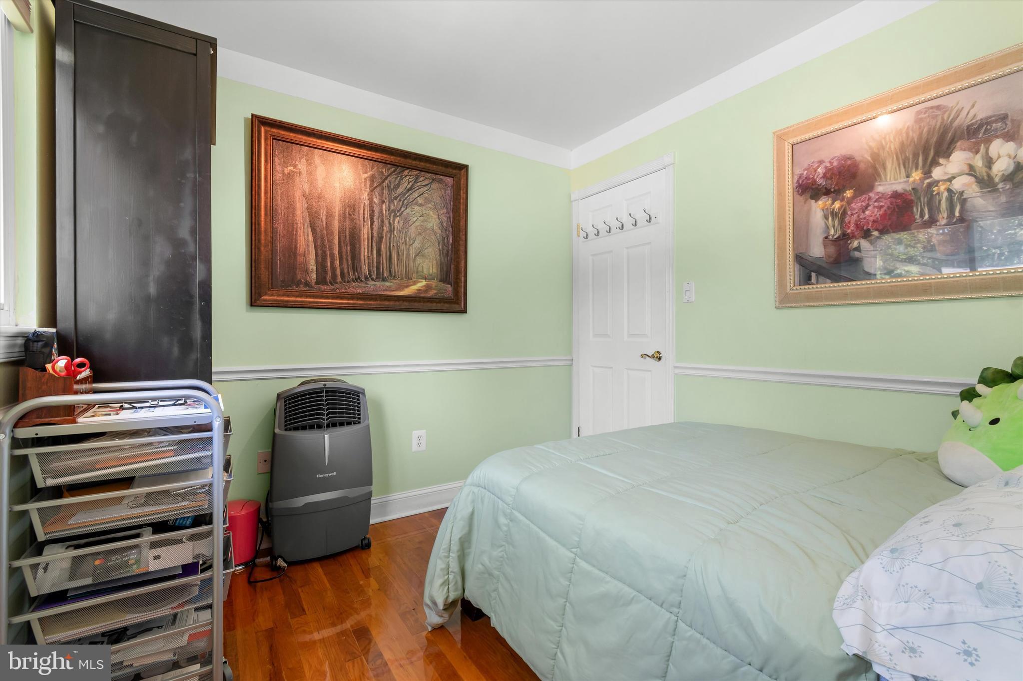 8304 Harland Drive Springfield, VA 22152 - Photo 24 of 39 a bedroom with bed and wooden floor
