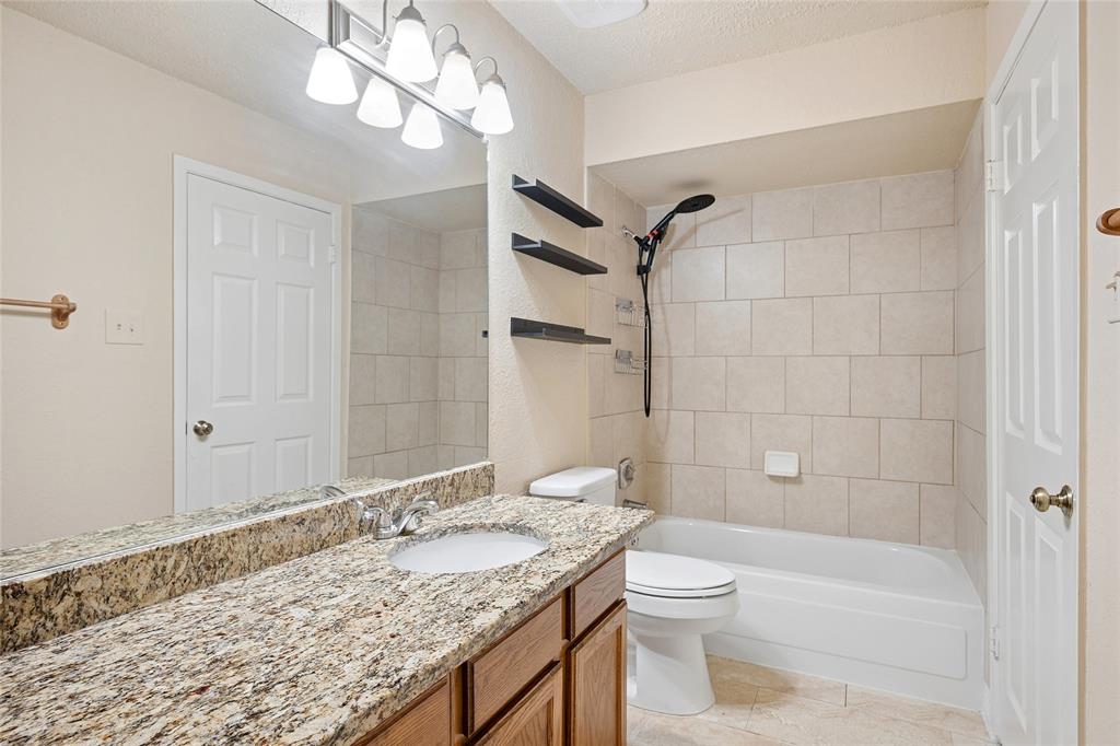 2400 Jupiter Road, Unit B9 Plano, TX 75074 - Photo 12 of 15 Bathroom with granite counters and updated lighting.