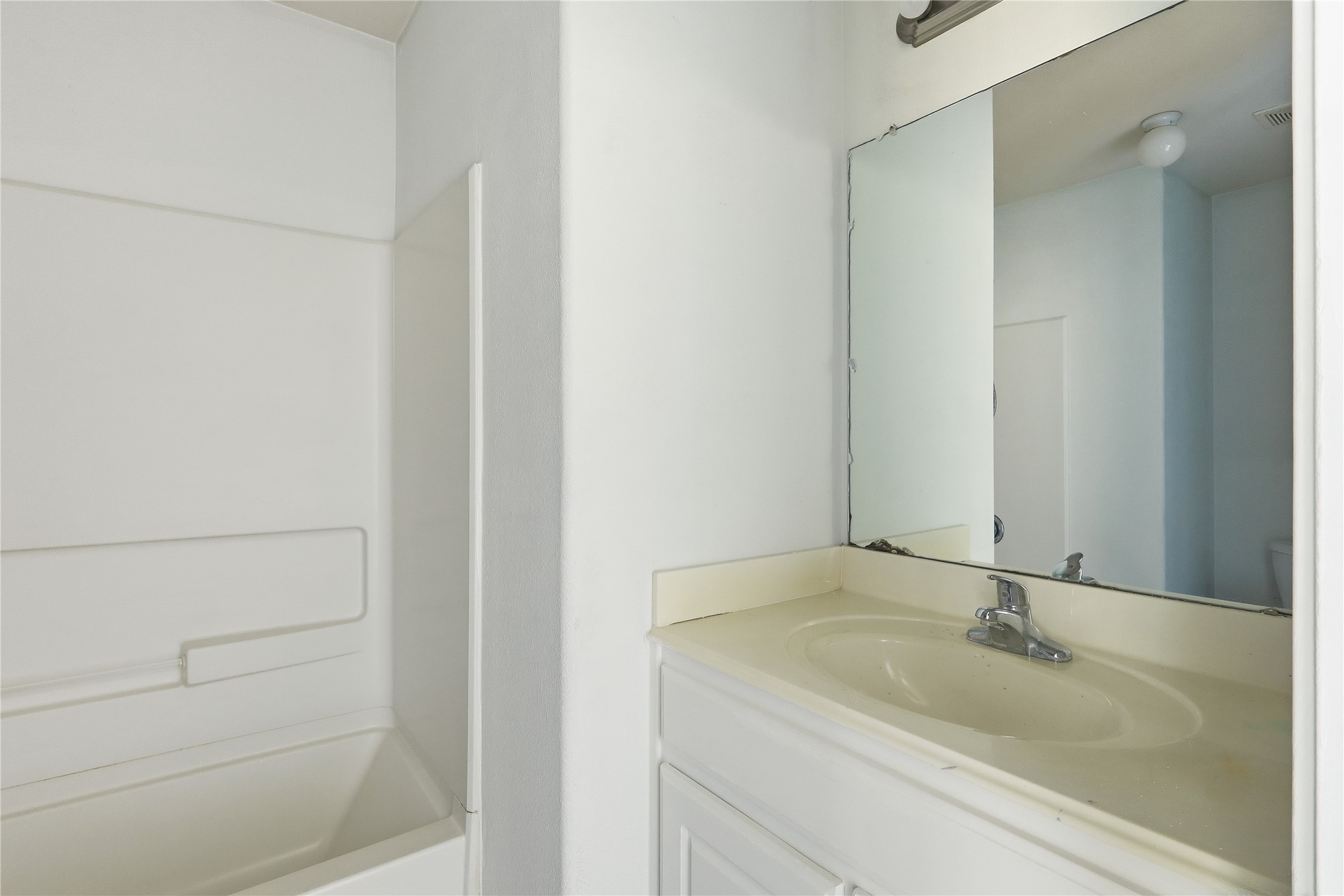 28807 Trinity River Drive Spring, TX 77386 - Photo 15 of 28 a bathroom with a sink and a mirror