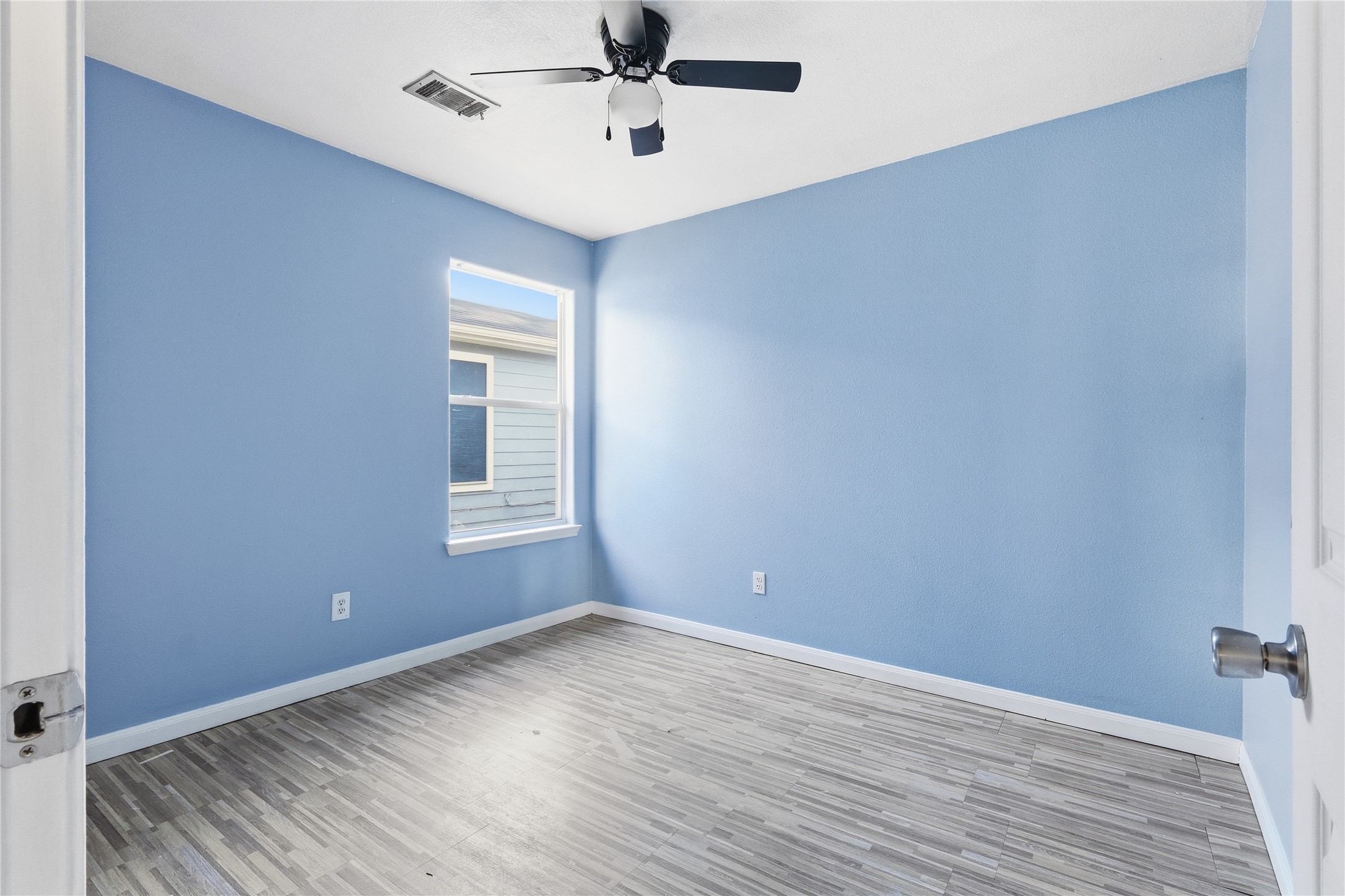 28807 Trinity River Drive Spring, TX 77386 - Photo 16 of 28 wooden floor in an empty room with a window