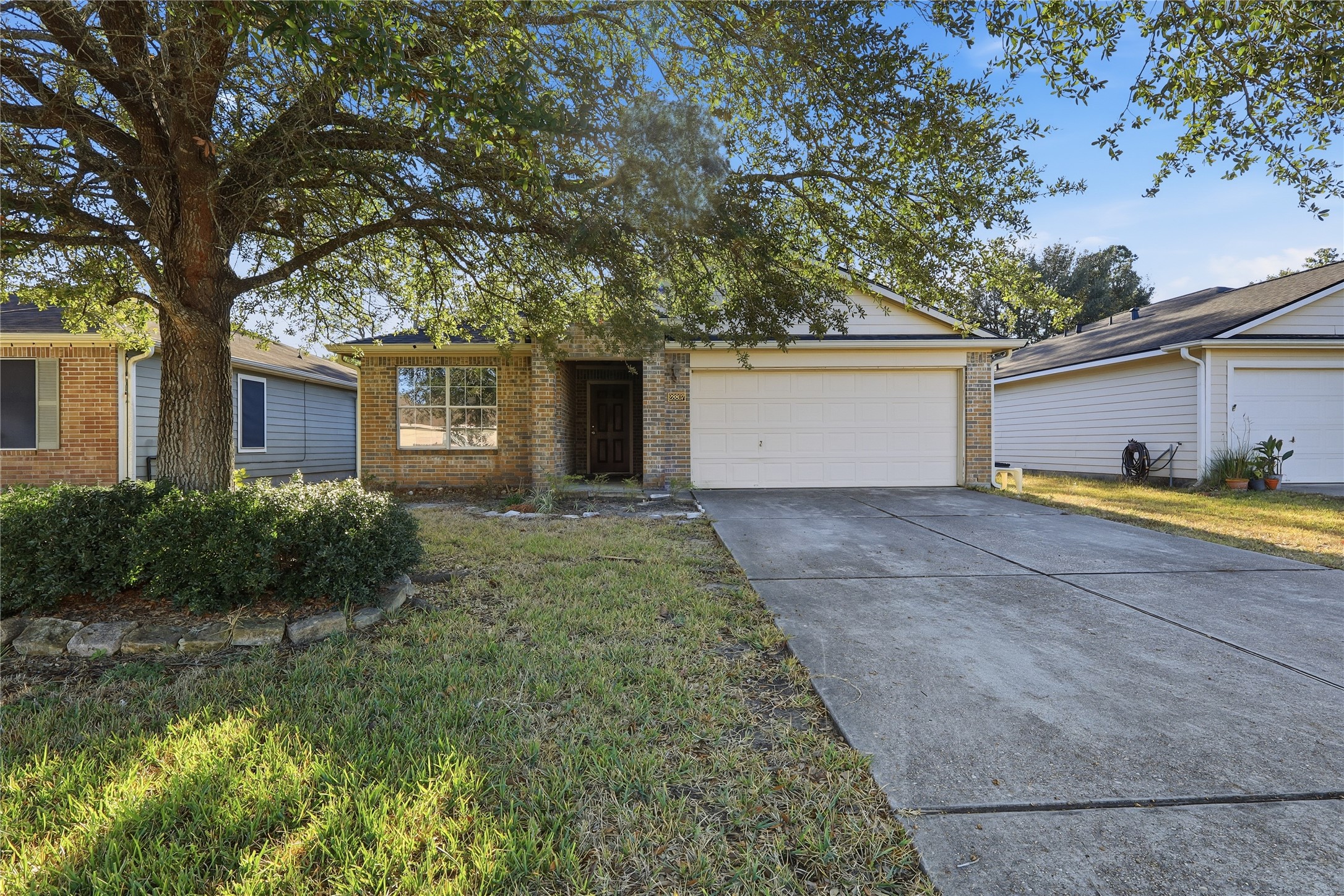 28807 Trinity River Drive Spring, TX 77386 - Photo 2 of 28 a front view of house with yard and trees