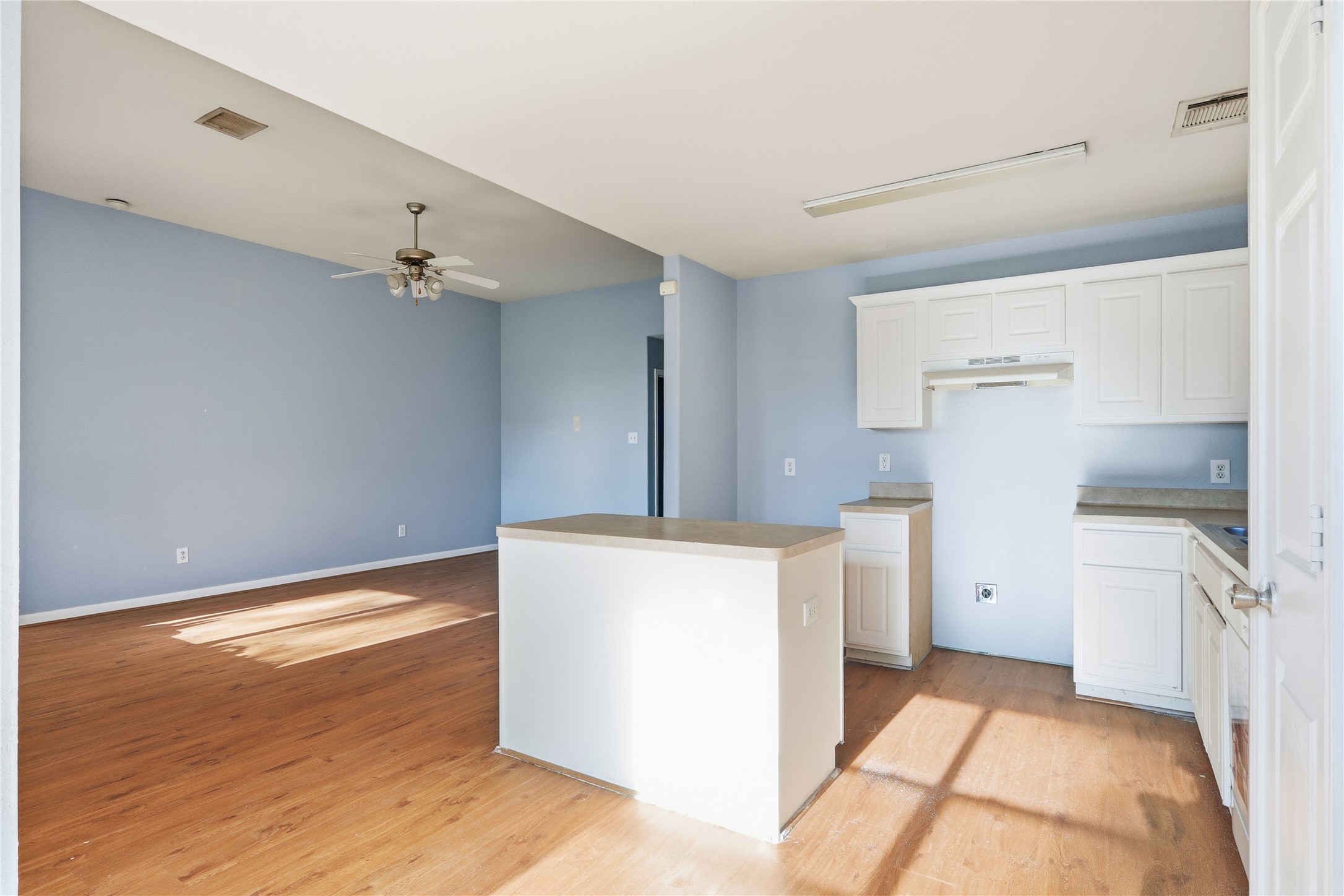 28807 Trinity River Drive Spring, TX 77386 - Photo 10 of 28 a kitchen with a refrigerator and white cabinets