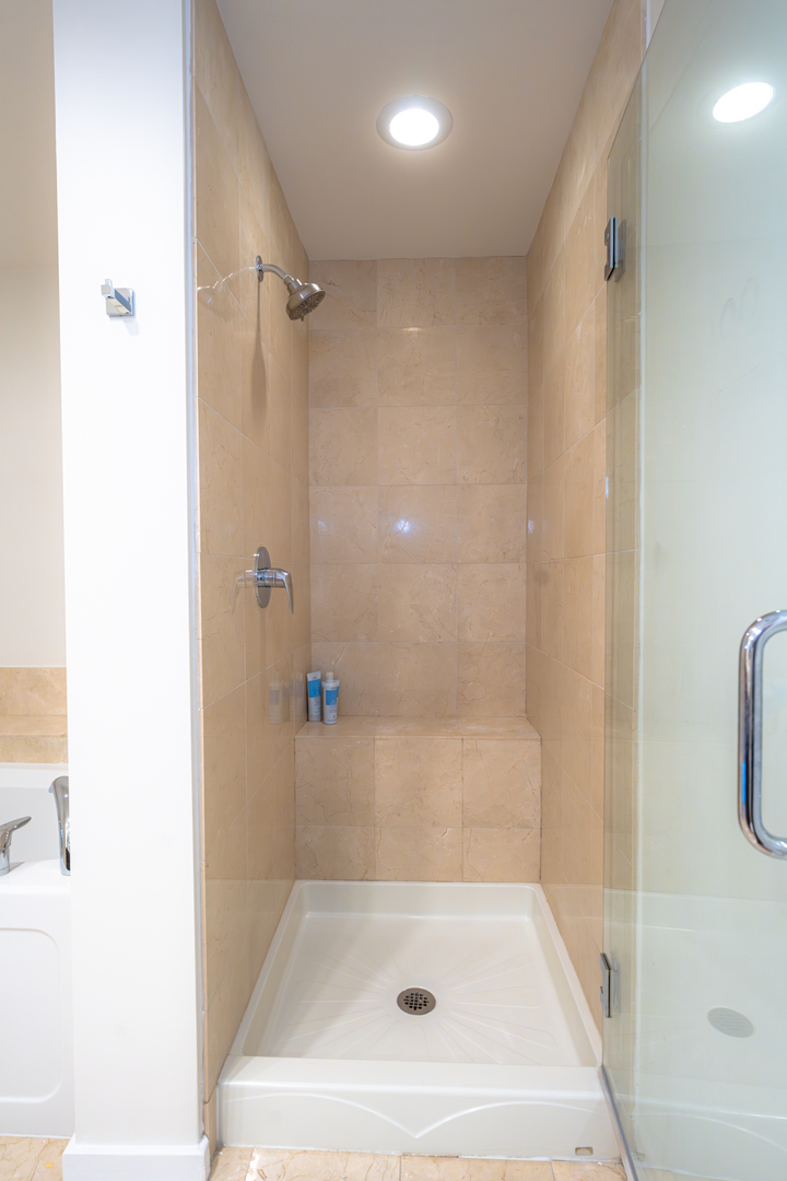 240 East Illinois Street, Unit 1606 Chicago, IL 60611 - Photo 11 of 22 a bathroom with a bath tub