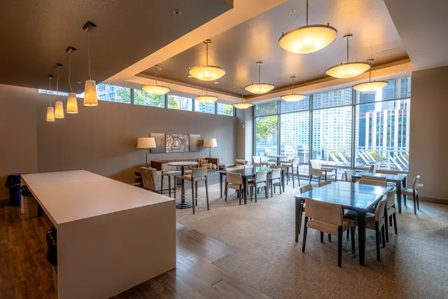 a view of a a dining room with furniture window and outside view