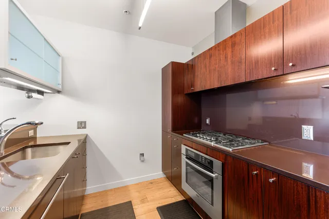 a kitchen that has a sink and a stove