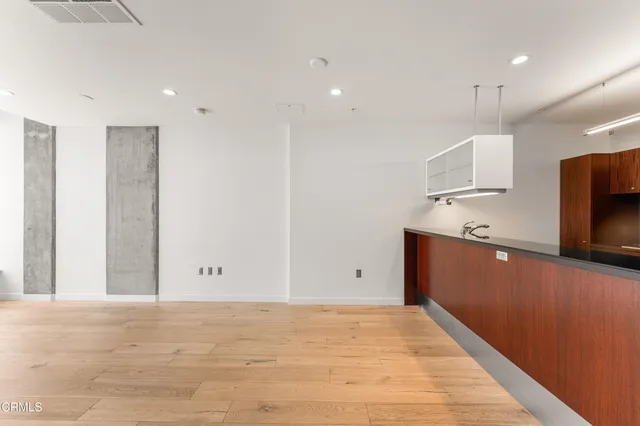 a view of kitchen with microwave and cabinets