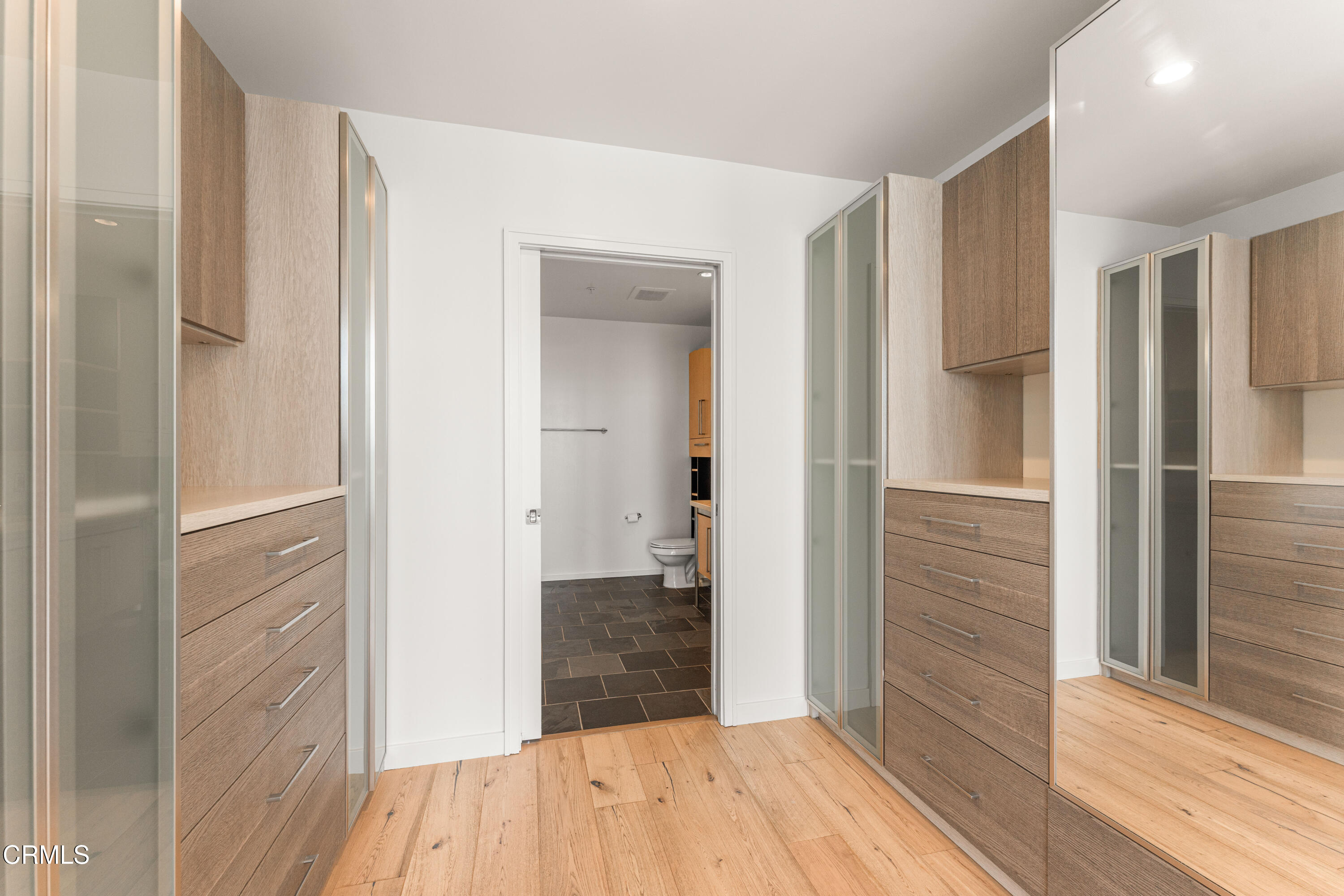 1155 South Grand Avenue, Unit 2106 Los Angeles, CA 90015 - Photo 23 of 51 a view of a hallway with wooden floor and staircase