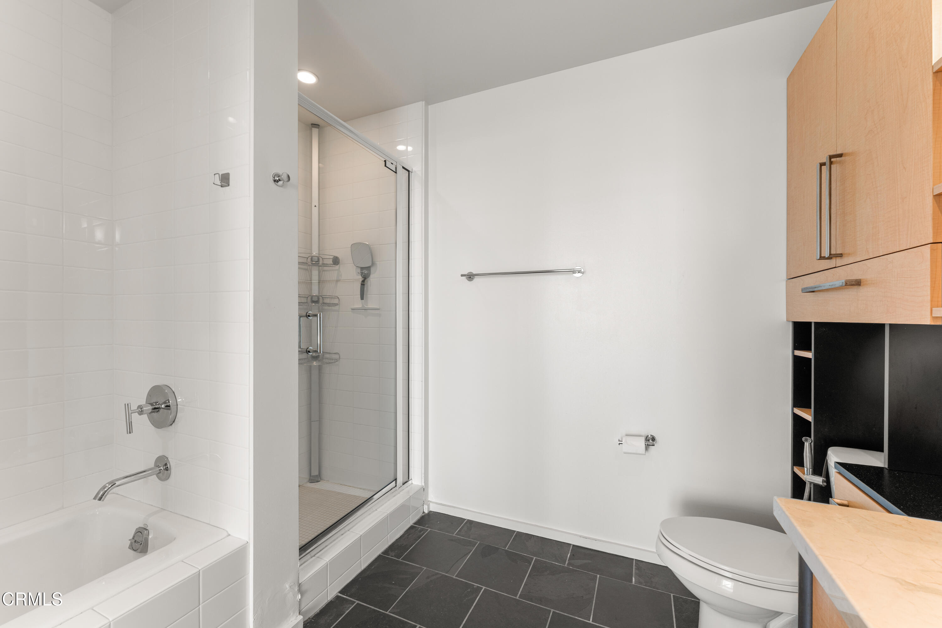 1155 South Grand Avenue, Unit 2106 Los Angeles, CA 90015 - Photo 26 of 51 a bathroom with a granite countertop bathtub shower sink vanity and toilet