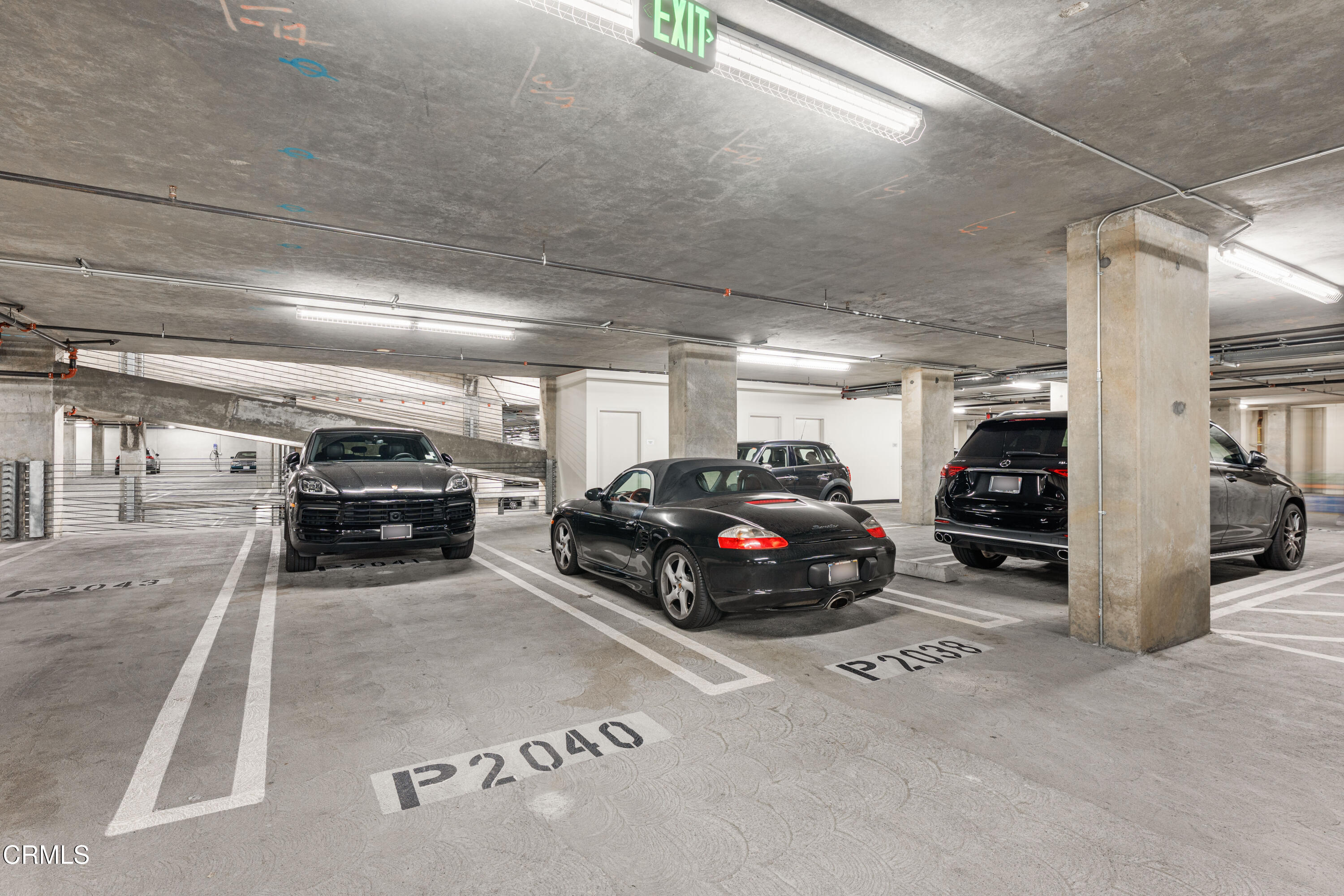 1155 South Grand Avenue, Unit 2106 Los Angeles, CA 90015 - Photo 33 of 51 a view of parking garage with cars parked