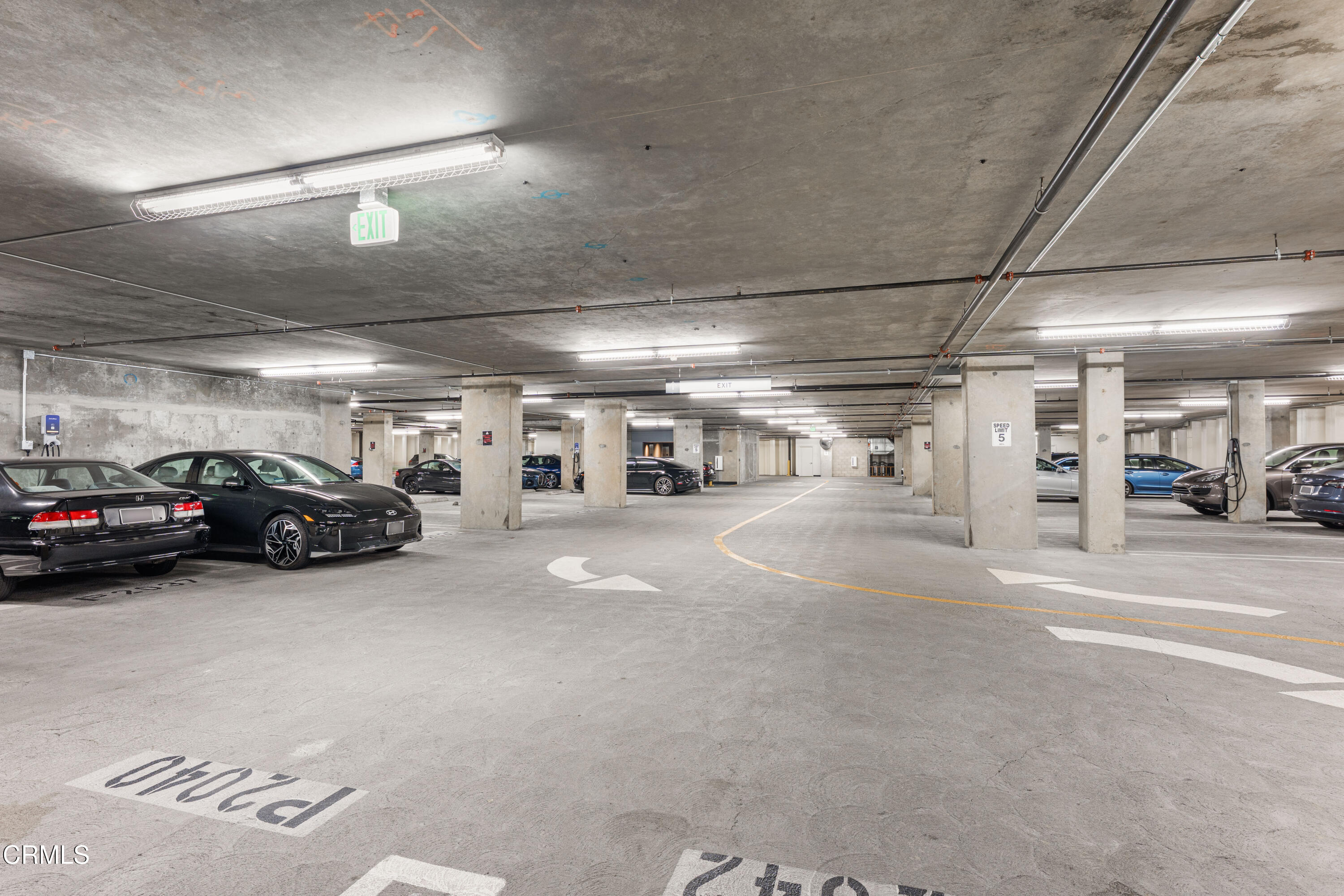 1155 South Grand Avenue, Unit 2106 Los Angeles, CA 90015 - Photo 34 of 51 a view of parking space with parked cars