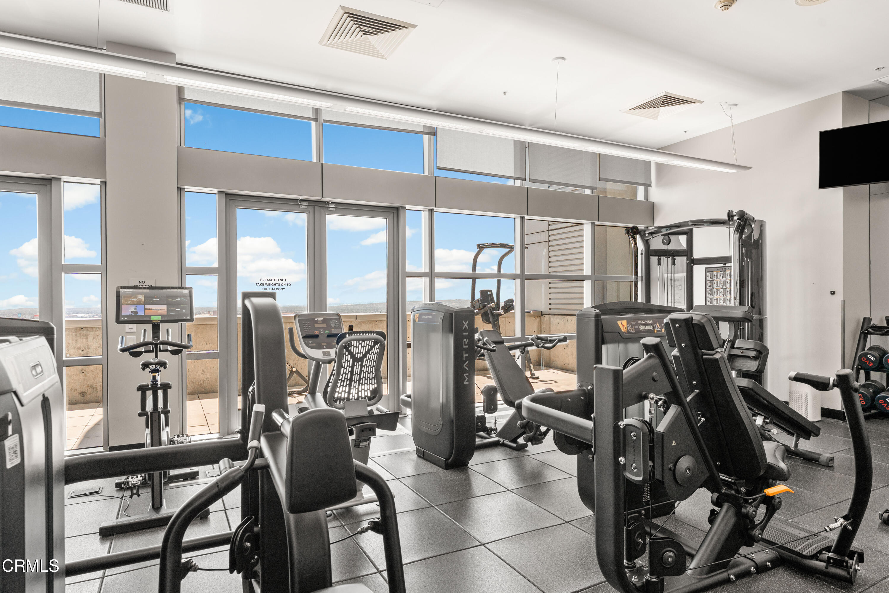 1155 South Grand Avenue, Unit 2106 Los Angeles, CA 90015 - Photo 35 of 51 a view of a room with gym equipment