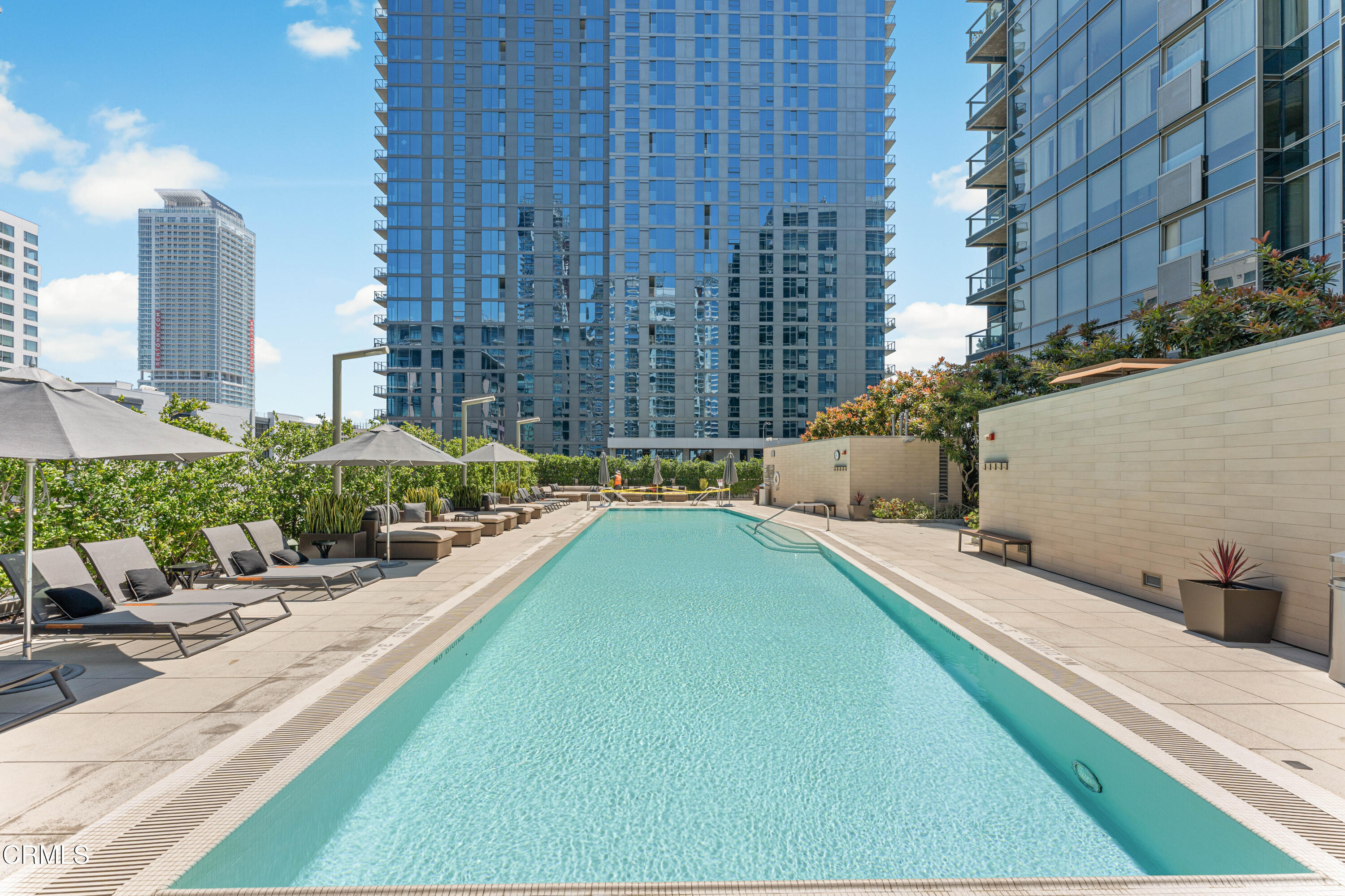1155 South Grand Avenue, Unit 2106 Los Angeles, CA 90015 - Photo 39 of 51 a swimming pool with outdoor seating and yard
