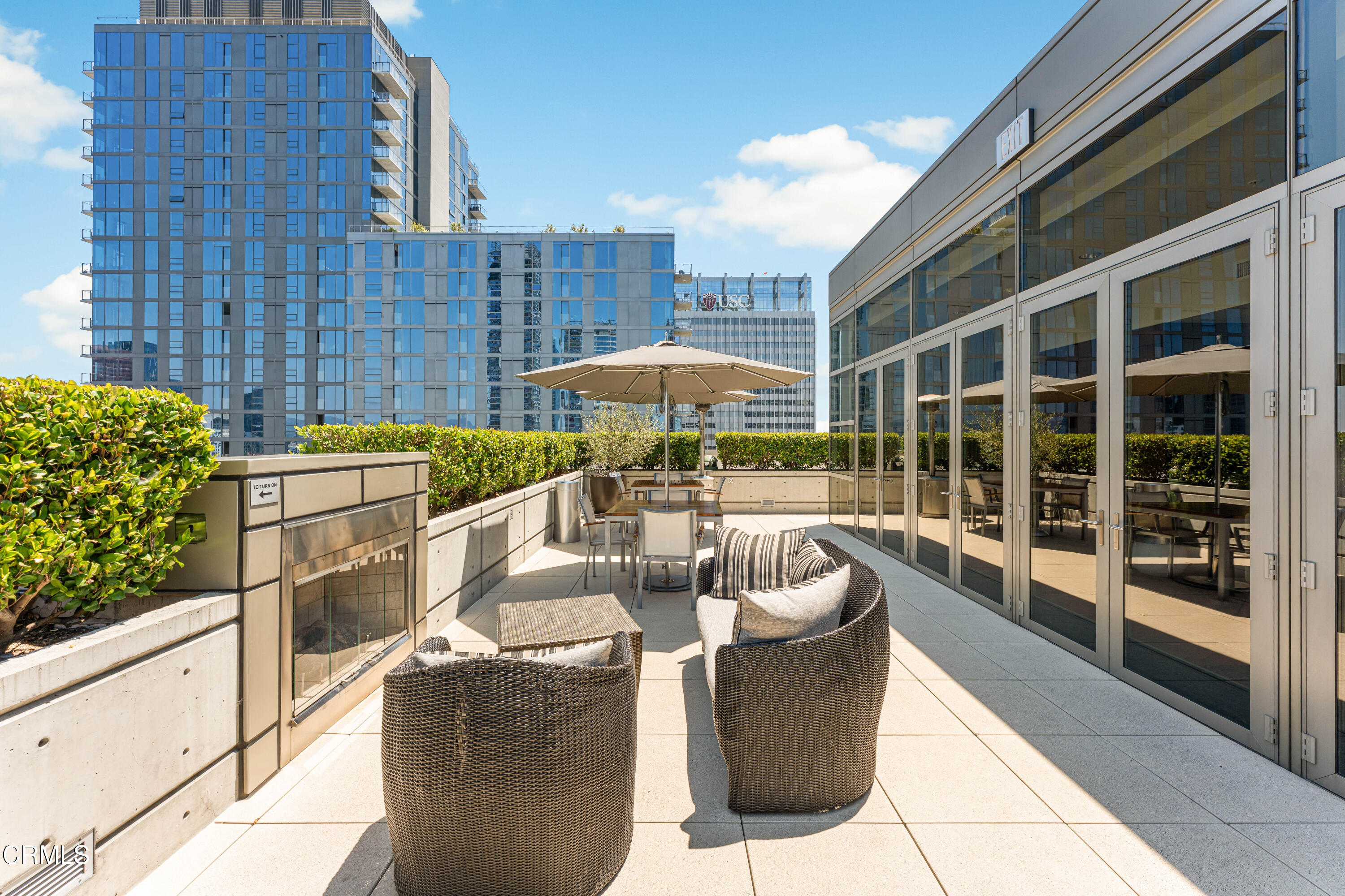 1155 South Grand Avenue, Unit 2106 Los Angeles, CA 90015 - Photo 42 of 51 a balcony with furniture and a potted plant